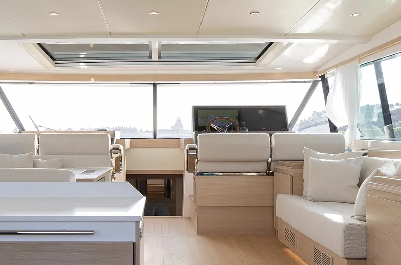  Yacht Photos Pics Luxurious interior of 2026 Delta Powerboats 72 yacht with modern seating and helm.