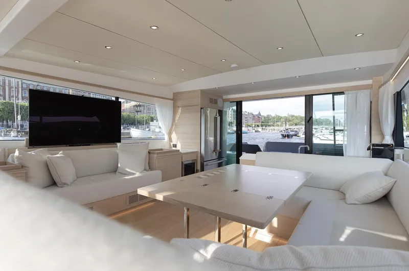  Yacht Photos Pics Luxurious interior of 2026 Delta Powerboats 72 yacht with modern furnishings and large windows.