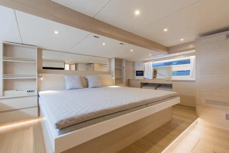  Yacht Photos Pics Luxurious bedroom interior of 2026 Delta Powerboats 72 yacht, featuring modern design and ambient lighting.