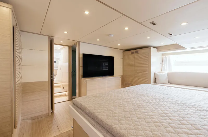  Yacht Photos Pics Luxurious interior of 2026 Delta Powerboats 72, featuring a spacious bedroom with modern amenities.