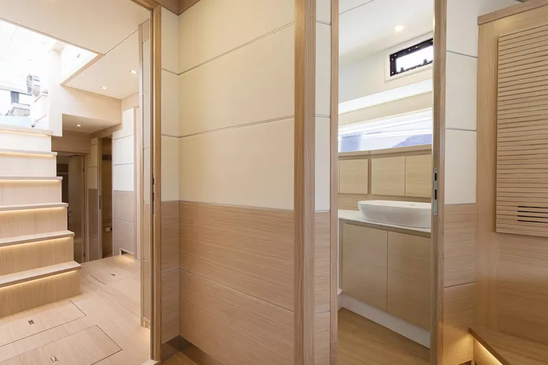  Yacht Photos Pics Luxurious interior of 2026 Delta Powerboats 72, featuring modern wood finishes and elegant design.