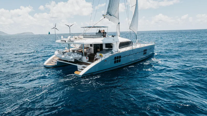 Mulan Yacht Photos Pics Luxury Sunreef 70 Sailing catamaran cruising on open sea, 2012 model.