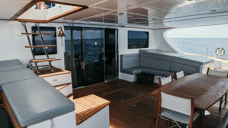 Mulan Yacht Photos Pics Luxurious Sunreef 70 Sailing yacht deck with seating and dining area, 2012 model.