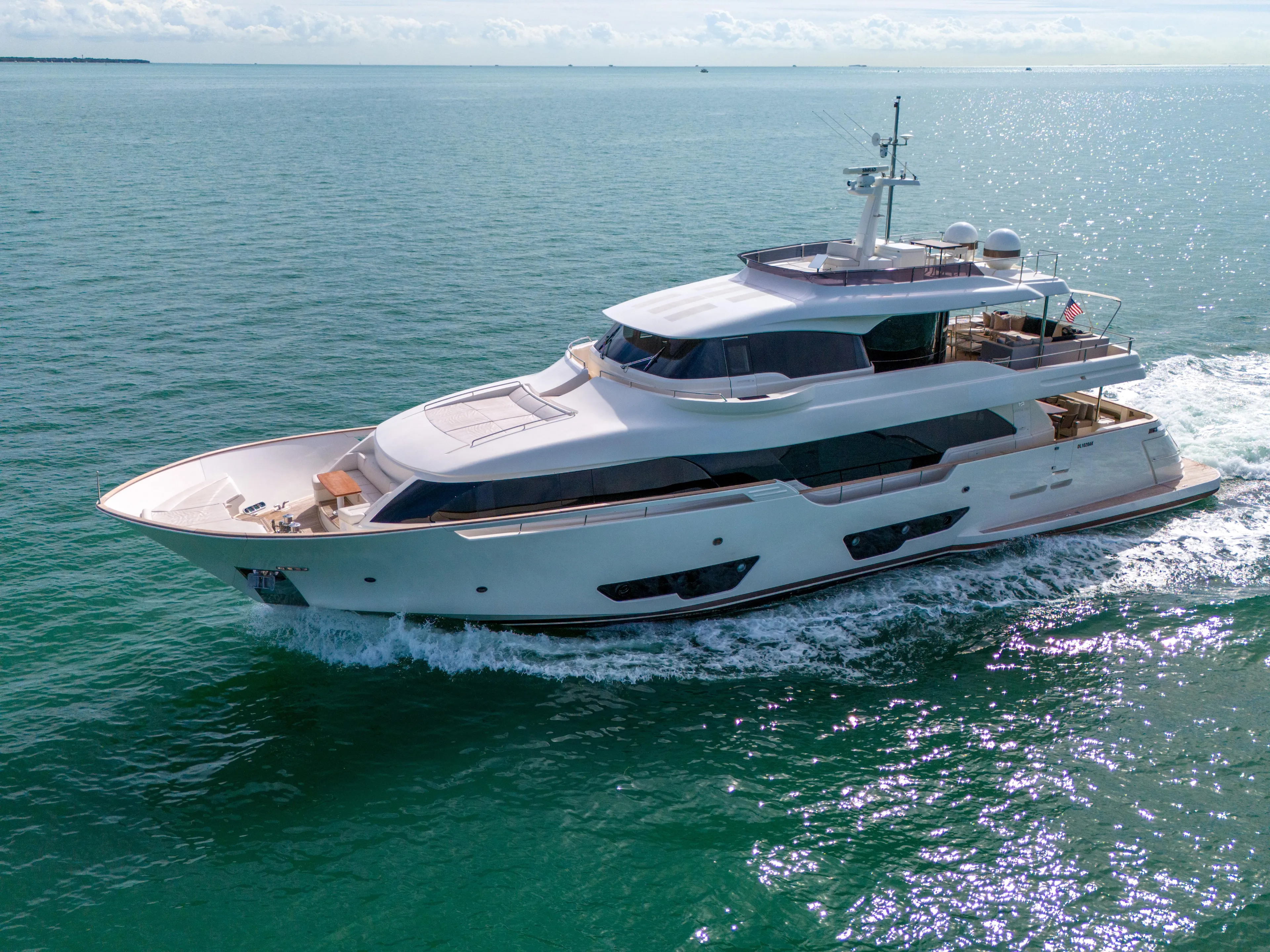 D'vinci Yacht Photos Pics Luxurious 2015 Custom Line Navetta 28 yacht cruising on open sea.
