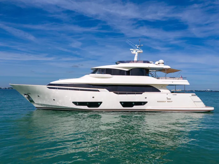 D'vinci Yacht Photos Pics Luxurious 2015 Custom Line Navetta 28 yacht on serene blue waters.