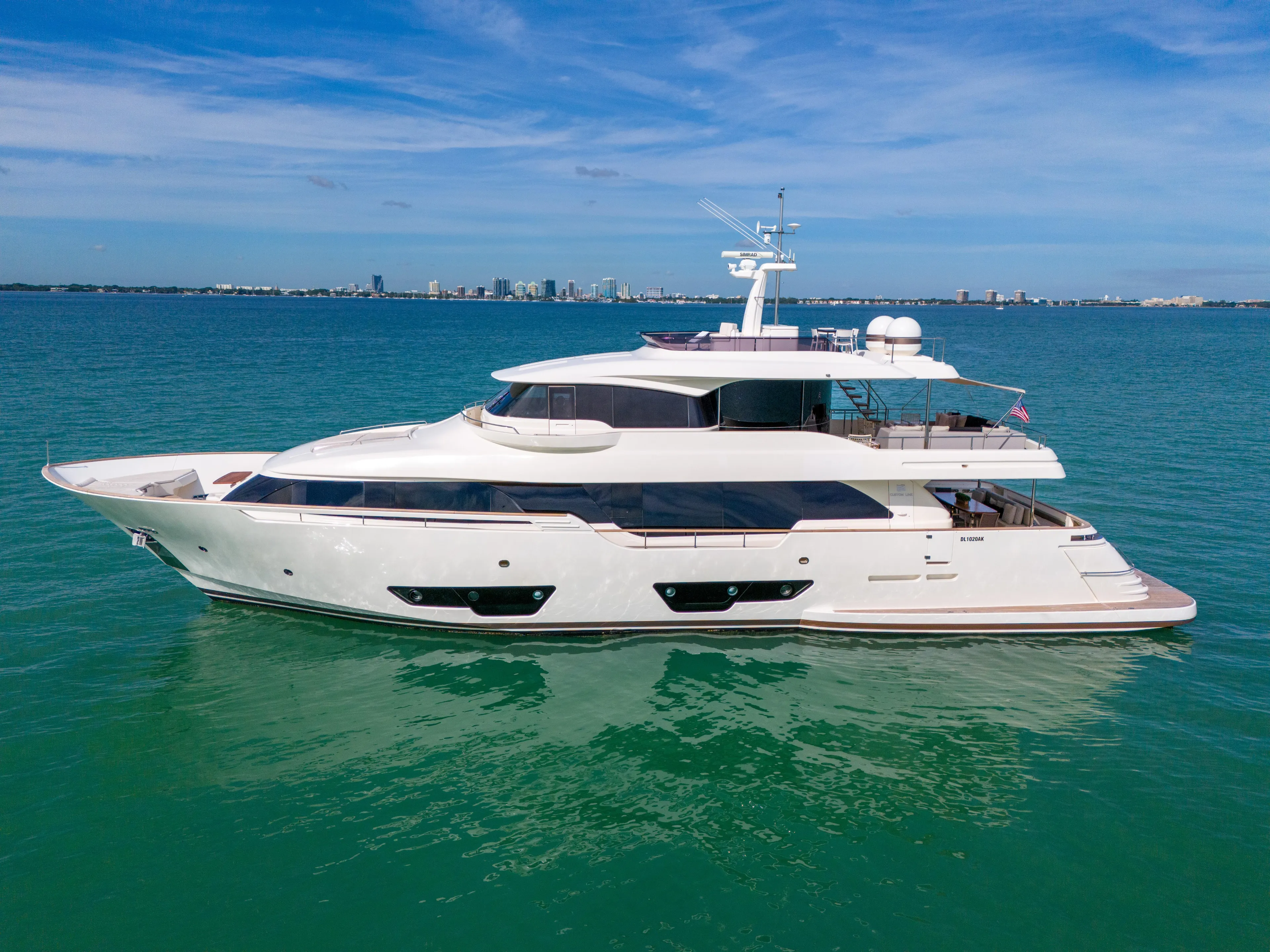 D'vinci Yacht Photos Pics Luxurious 2015 Custom Line Navetta 28 yacht cruising on serene blue waters.