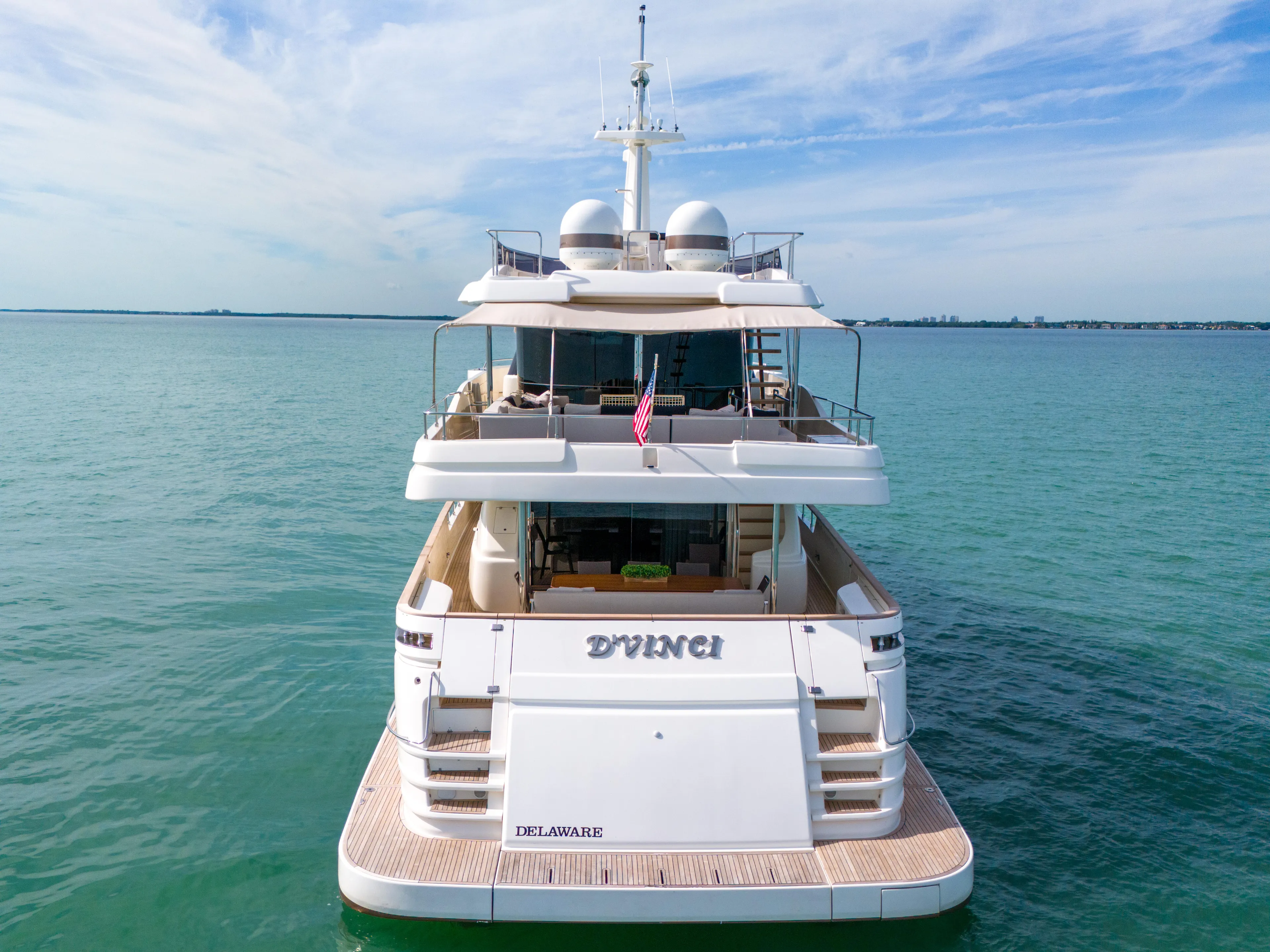 D'vinci Yacht Photos Pics Luxury yacht Custom Line Navetta 28, 2015 model, on serene ocean waters.