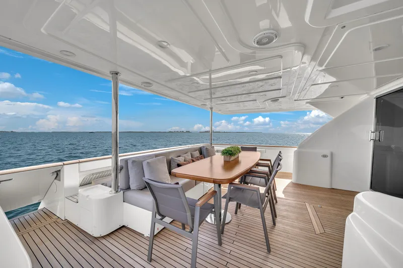 D'vinci Yacht Photos Pics Luxurious 2015 Custom Line Navetta 28 yacht deck with elegant dining area.