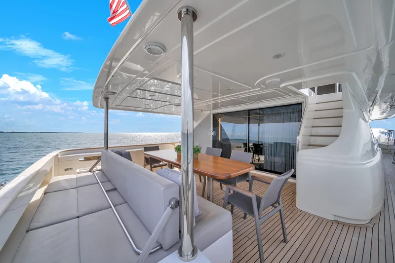 D'vinci Yacht Photos Pics Luxurious 2015 Custom Line Navetta 28 yacht deck with seating and dining area.