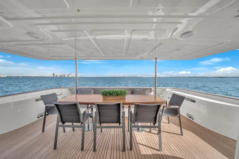 D'vinci Yacht Photos Pics Luxurious 2015 Custom Line Navetta 28 yacht deck with dining area overlooking the ocean.