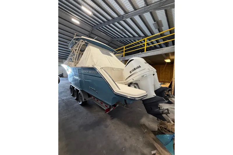  Yacht Photos Pics 2018 Grady-White Freedom 325 boat with Yamaha engines in a storage facility.