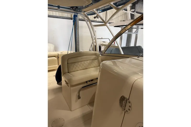  Yacht Photos Pics 2018 Grady-White Freedom 325 boat interior with cushioned seating and sleek design.