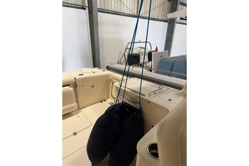  Yacht Photos Pics 2018 Grady-White Freedom 325 boat interior with fenders and seating in a storage area.