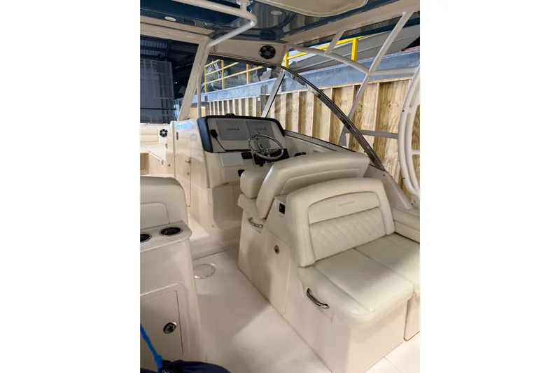  Yacht Photos Pics 2018 Grady-White Freedom 325 boat interior with luxurious seating and modern dashboard.