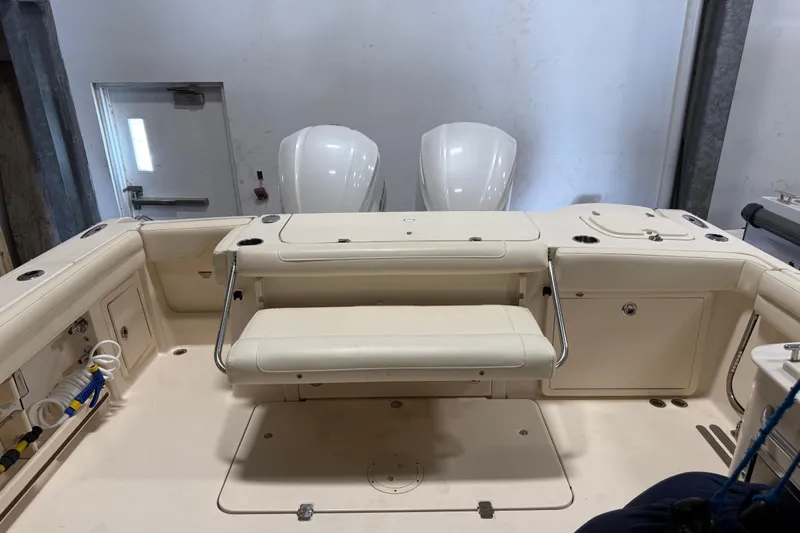  Yacht Photos Pics 2018 Grady-White Freedom 325 boat interior with seating and storage compartments.