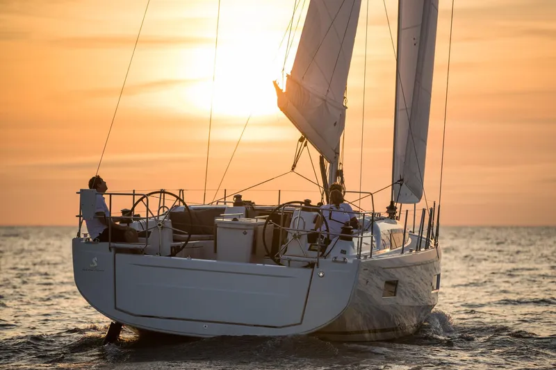  Yacht Photos Pics 2026 Beneteau 40.1 sailboat cruising at sunset on open water.