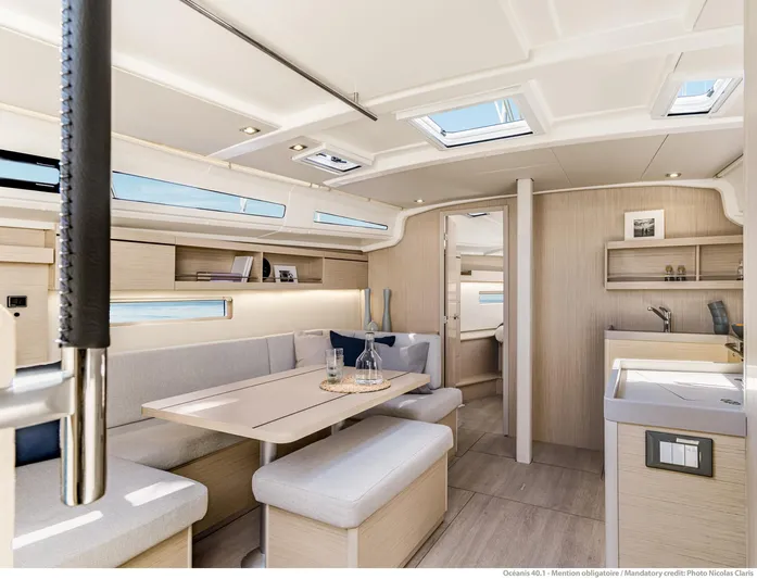  Yacht Photos Pics Luxurious interior of 2026 Beneteau 40.1 yacht with modern furnishings and ample natural light.
