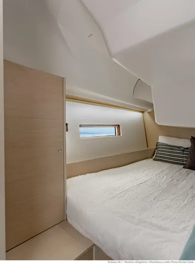  Yacht Photos Pics Interior cabin of 2026 Beneteau 40.1 yacht with modern design and cozy bedding.