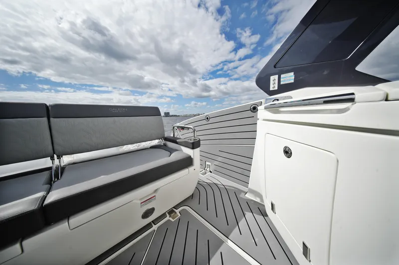  Yacht Photos Pics 2023 Galeon 400 XL yacht interior with sleek seating and modern design under a cloudy sky.