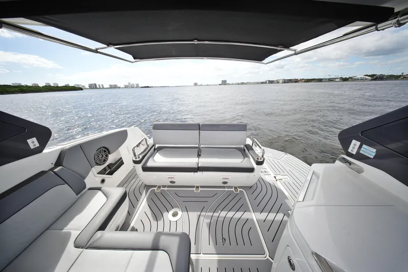  Yacht Photos Pics 2023 Galeon 400 XL yacht deck with seating, overlooking calm waters.