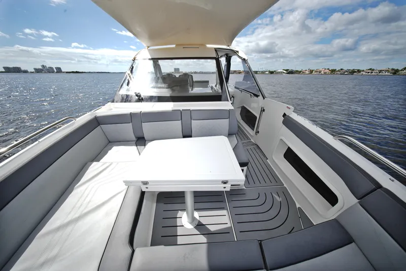  Yacht Photos Pics 2023 Galeon 400 XL yacht interior with seating and table on open water.