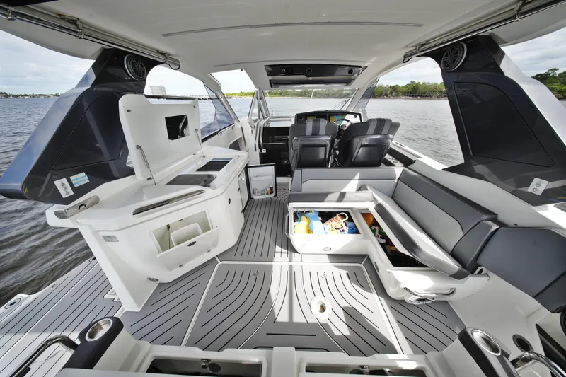  Yacht Photos Pics 2023 Galeon 400 XL yacht interior with seating, storage, and helm on open water.