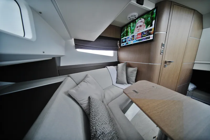  Yacht Photos Pics Luxurious interior of 2023 Galeon 400 XL yacht with cozy seating and modern TV.
