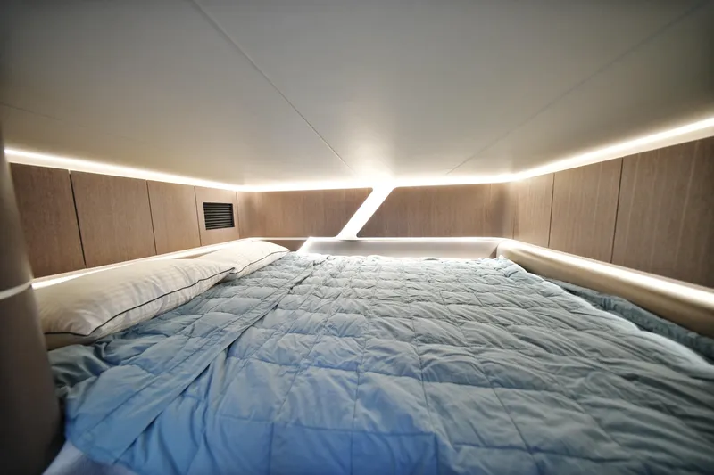  Yacht Photos Pics Luxurious cabin interior of 2023 Galeon 400 XL yacht with modern lighting and bedding.