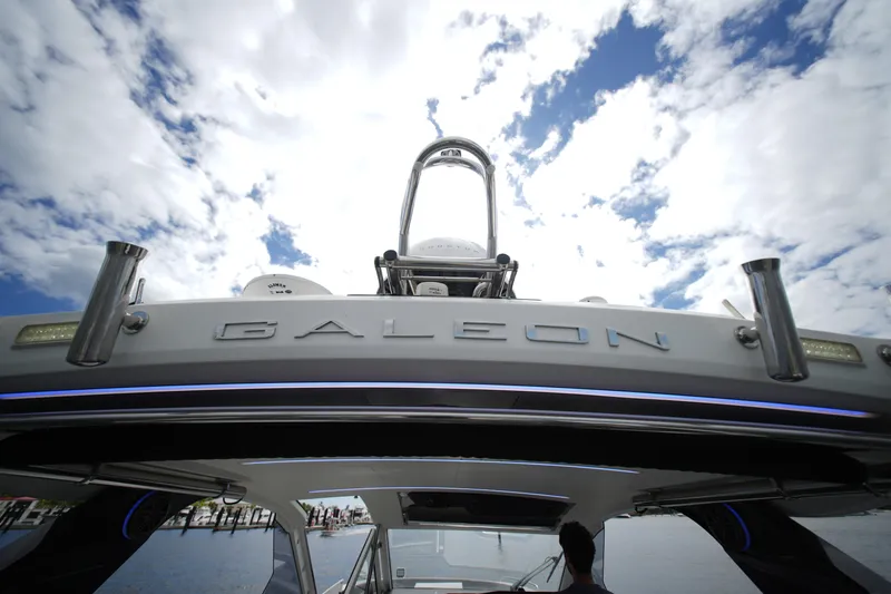  Yacht Photos Pics 2023 Galeon 400 XL yacht against a cloudy sky, showcasing sleek design and modern features.