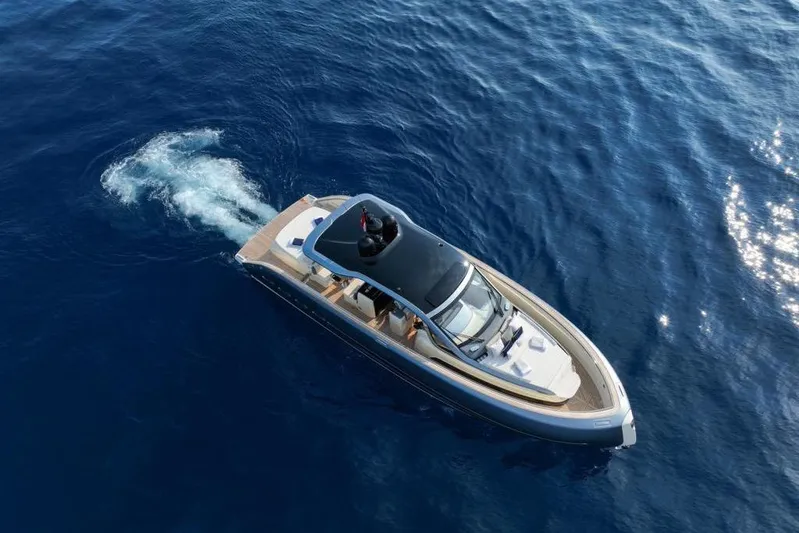  Yacht Photos Pics 2023 Invictus 460TT luxury yacht cruising on open blue sea.