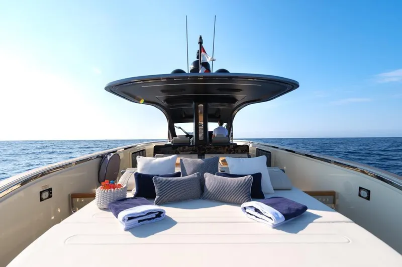  Yacht Photos Pics Luxurious 2023 Invictus 460TT yacht with sunbathing area and ocean view.
