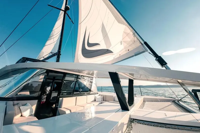  Yacht Photos Pics 2024 Wave Wave60 yacht with sleek design, sailing on open water under clear skies.