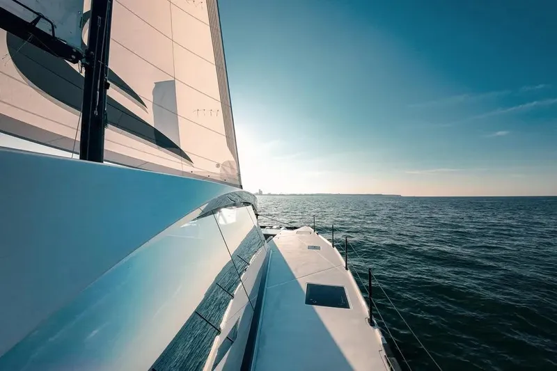  Yacht Photos Pics Sailing on a 2024 Wave Wave60 yacht under clear blue skies.