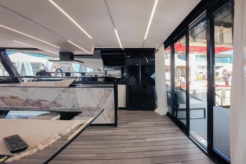 Yacht Photos Pics Luxurious interior of 2024 Wave Wave60 yacht with modern design and glass doors.