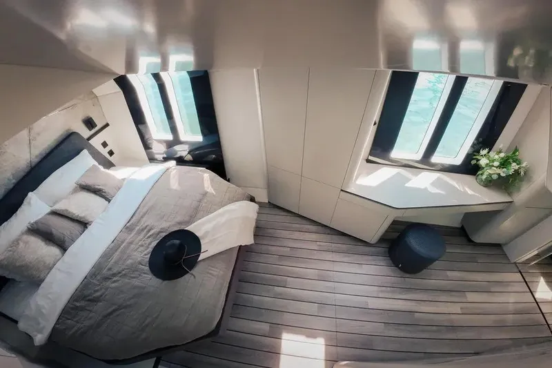  Yacht Photos Pics Luxurious Wave60 yacht bedroom interior, 2024 model, featuring elegant design and large windows.