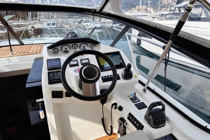  Yacht Photos Pics Cockpit of 2025 Cranchi Z35 yacht with modern navigation controls and steering wheel.