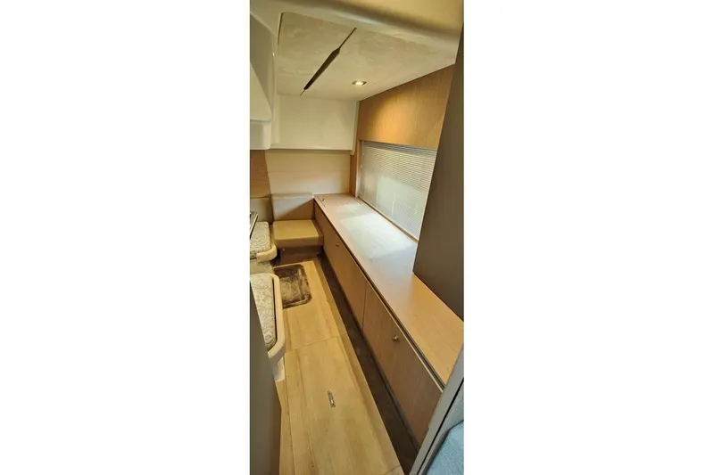  Yacht Photos Pics Interior of 2025 Cranchi Z35 yacht, featuring sleek wood cabinetry and modern design.