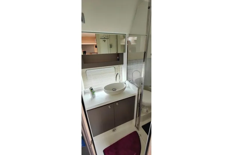  Yacht Photos Pics Modern bathroom interior of 2025 Cranchi Z35 yacht with sleek sink and mirror.