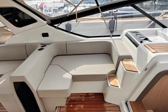  Yacht Photos Pics 2025 Cranchi Z35 yacht interior with sleek seating and wooden accents.