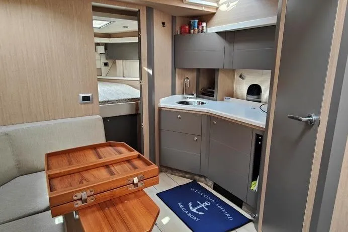  Yacht Photos Pics Interior of 2025 Cranchi Z35 yacht featuring modern kitchen and cozy seating area.