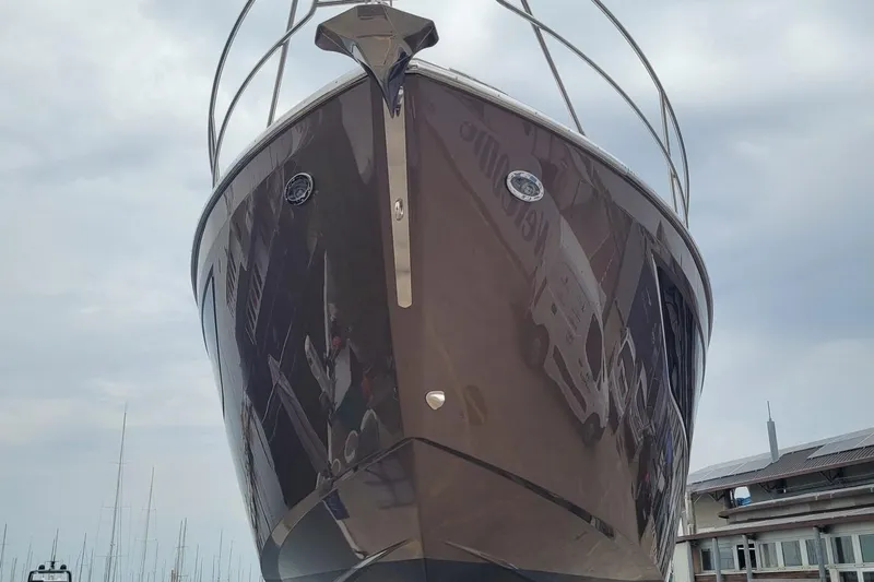  Yacht Photos Pics 2025 Cranchi Z35 yacht, front view, docked with cloudy sky background.