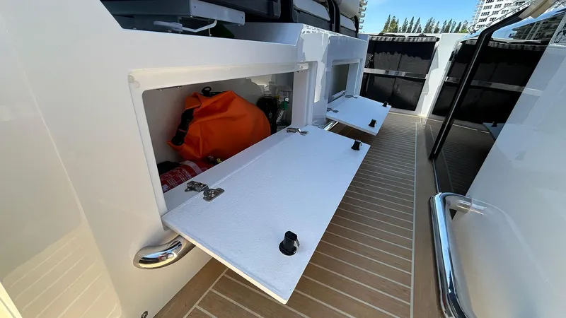  Yacht Photos Pics 2025 De Antonio Yachts D36 storage compartments on deck with open hatches.