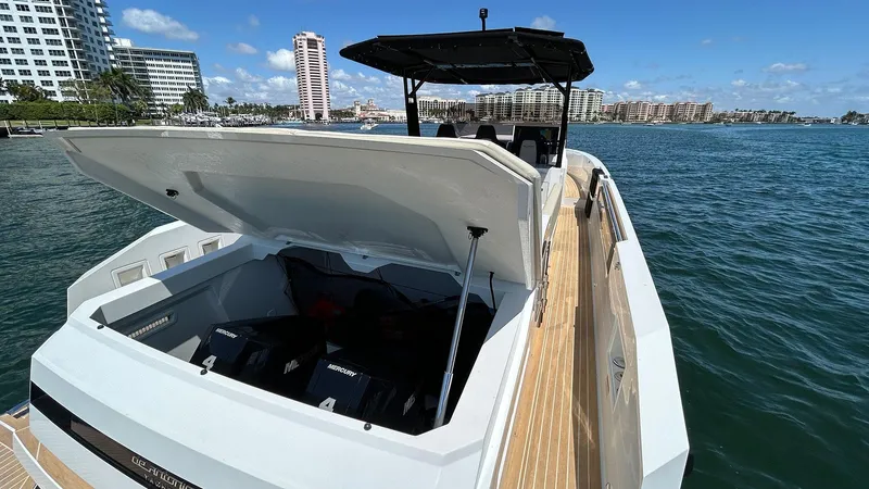 Yacht Photos Pics 2025 De Antonio Yachts D36 on water, open engine compartment, modern design, sunny day.