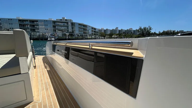  Yacht Photos Pics 2025 De Antonio Yachts D36, sleek deck view, modern waterfront backdrop.