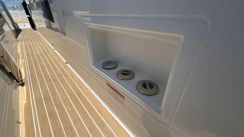  Yacht Photos Pics 2025 De Antonio Yachts D36 deck with fuel cap compartment, showcasing sleek design.