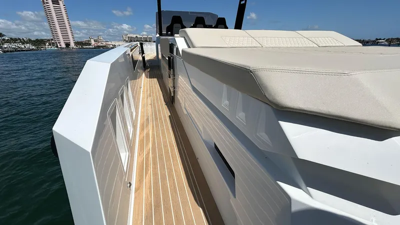  Yacht Photos Pics 2025 De Antonio Yachts D36 with sleek deck design and luxurious seating on open water.
