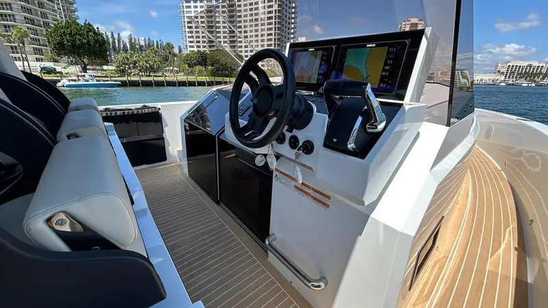  Yacht Photos Pics 2025 De Antonio Yachts D36 helm with modern controls and waterfront view.
