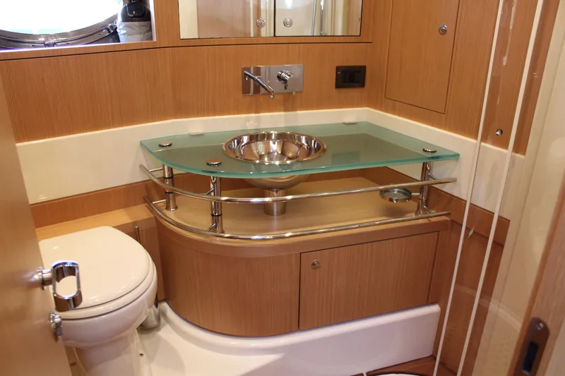 Happy Go Lucky Yacht Photos Pics Luxurious bathroom in 2009 Riva SportRiva 56 yacht with modern fixtures and elegant design.