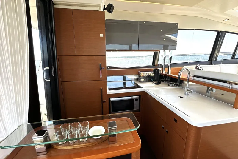 Eribella Yacht Photos Pics Luxurious kitchen interior of 2016 Prestige 500 S yacht with modern amenities.