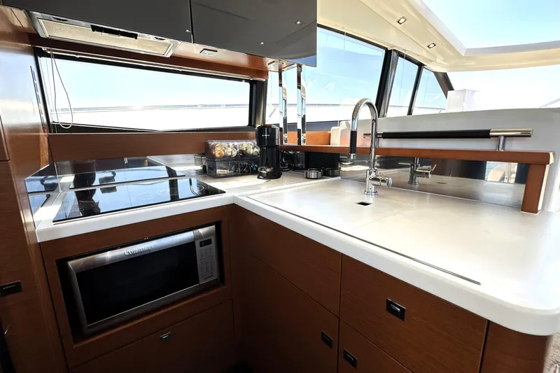 Eribella Yacht Photos Pics Modern kitchen interior on 2016 Prestige 500 S yacht, featuring sleek appliances and ample counter space.